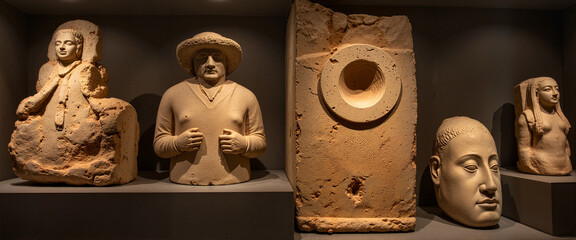 Ancient stone sculptures displayed in museum, cultural heritage