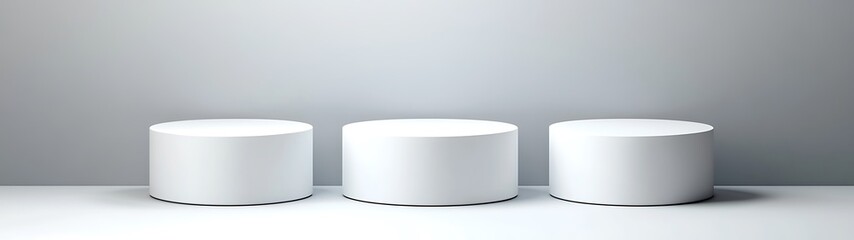 Three white cylindrical display platforms sit in a studio scene