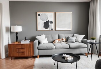Scandinavian living room interior with a modern gray sofa, wooden commode, black table, lamp, and abstract paintings. A beautiful dog rests on the couch. Stylish home decor.