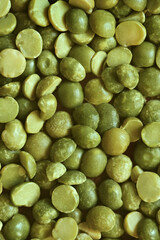 Dried and split green peas on a surface. Top view. food background. raw dried green split peas
