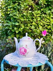 white teapot with pink flowers
