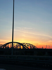 bridge over the river at sunset