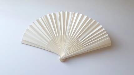 A minimalistic white folding hand fan, elegantly opened and set apart against a clean white background, showcasing its delicate pleats and structure with soft shadows.