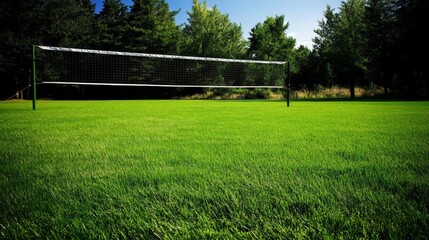 A volleyball is in the air and is about to hit the net. The net is made of a mesh material