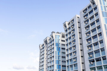 Fototapeta premium Public housing in Singapore against blue sky