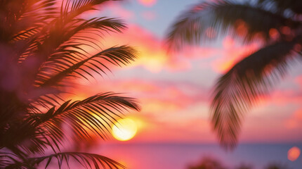 Exotic sunset featuring blurred palm trees with vibrant pinks and oranges. Beautiful tropical paradise at sundown.