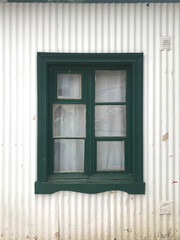 Wooden window in an old tin house in Argentine Patagonia
