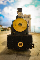 An old steam locomotive on display in the historic center of the city of São Luís, Maranhão, Brazil, with a blurred background