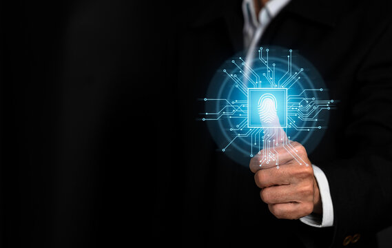Cyber security concept. Man using thumb to scan finger print or for digital processing biometric identification to access security system includes internet banking, cloud system. - Powered by Adobe