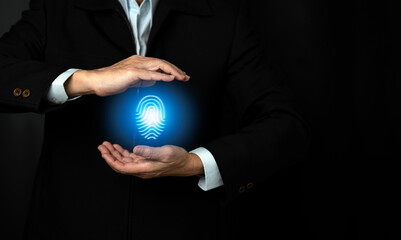 Cyber security concept. Man holding the icon of  finger print or for digital processing biometric identification to access security system includes internet banking, cloud system.