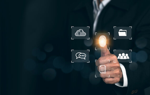 Cyber security concept. Man using thumb to scan finger print or for digital processing biometric identification to access security system includes internet banking, cloud system.