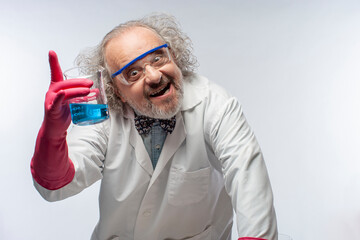 Mad Scientist in white lab coat holding a flask with blue liquid