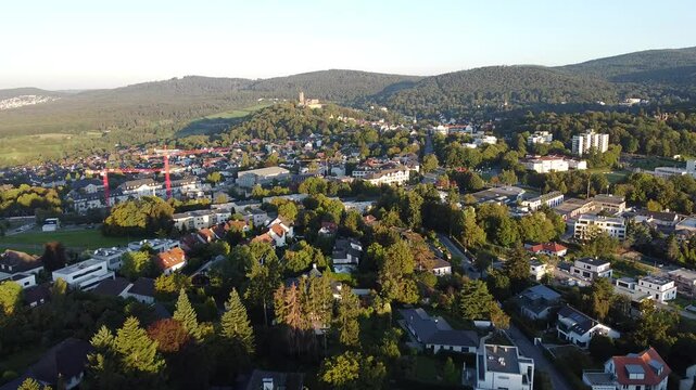 Flyover small green town K&ouml;nigstein im Taunus,  Germany at sunrise
