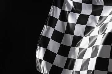One racing checkered flag on black background, space for text
