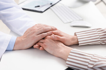 Dependent woman having appointment with addiction specialist in clinic, closeup