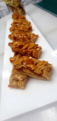 Almond Brittle Dessert on White Plate