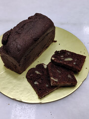 Chocolate Bread Loaf with Slices on Golden Plate