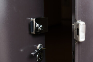 Exterior door handle and Security lock on Metal frame.