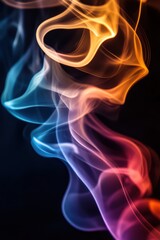 A close-up of colorful incense smoke, forming mesmerizing waves against a dark background