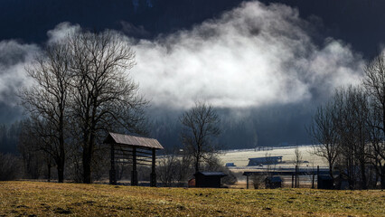 Traditional Slovenian Hayrack in winter morning Landscape near Kranjska Gora - Slovenia