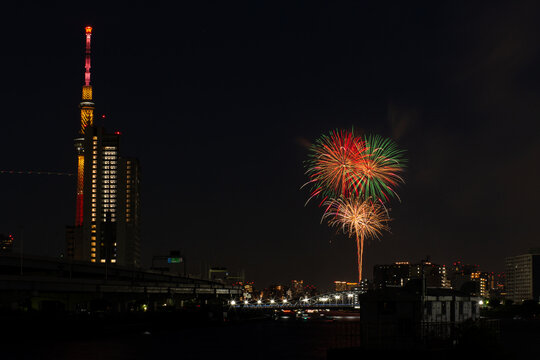 night scenery of sumida river fireworks festival 2023 with tokyo sky tree seen from shioiri park in minami-senju, arakawa city