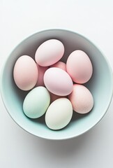 Colorful Easter Eggs in a Light Bowl on a Soft Background, Perfect for Spring Celebrations and Holiday Decorations