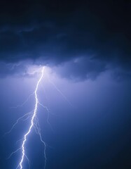A jagged white lightning bolt illuminates a dark, stormy night sky, lightning strike, nature photography, power
