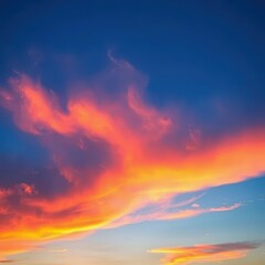 Obraz premium Vibrant sky transitioning from deep blue to fiery orange sunset hues, photo, stock, landscape