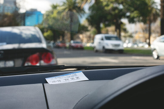 Parking ticket placed on car dashboard in Melbourne inner city