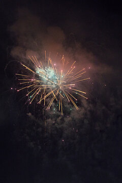 Colourful fireworks display in sky at night