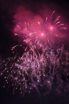 Colourful fireworks display in sky at night