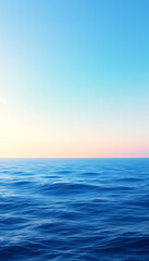 Fototapeta premium Calm ocean water view with light blue sky at sunset