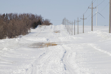 Rural Minnesota road drifted over with snow