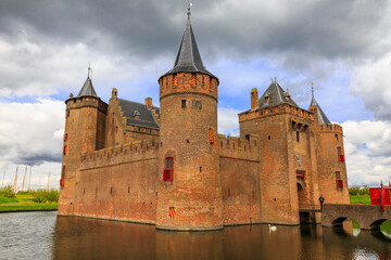 Fototapeta premium Europe,Netherlands, Muiden. Muiderslot Castle located on Vecht river. Fortress for water defense.