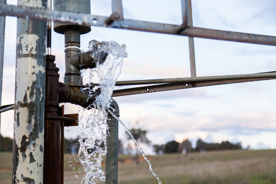 Windmill pumping water from one dam to another to clean it