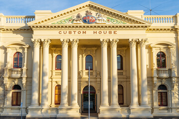 Eight large columns supporting the portico of an historic building