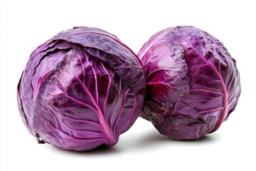 Two vibrant purple cabbages, close-up, against a plain white backdrop.  Deeply colored leaves tightly packed.  Fresh and healthy