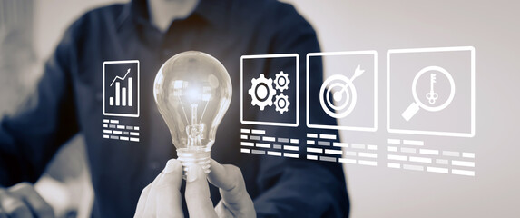 Hand chooses light bulb with business creativity icons for plan to goal or creative idea innovation...