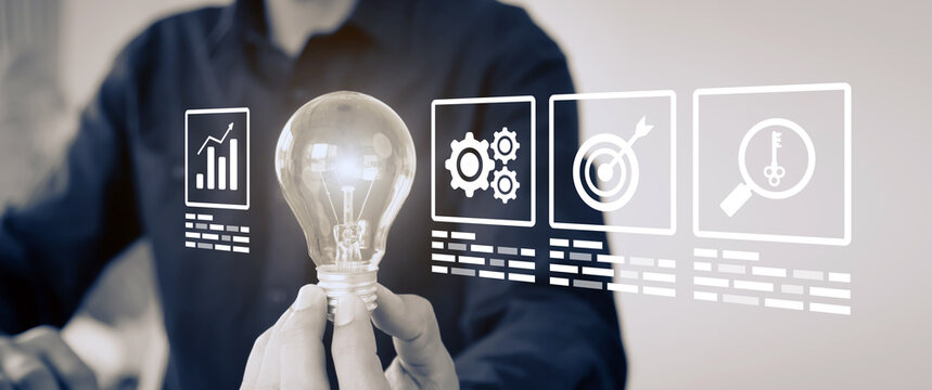 Hand chooses light bulb with business creativity icons for plan to goal or creative idea innovation or study education or analyzing marketing data management and target growth or human resources.