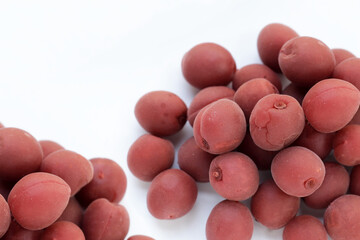 Umeboshi, Japanese pickled plums, Sour and salty taste.