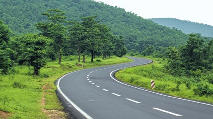 Scenic Curving Toll Road Through Isolated Green Hills