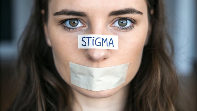 Mental Health Stigma Awareness. A woman with a "STIGMA" label on her forehead and tape over her mouth, symbolizing silence and stigma.