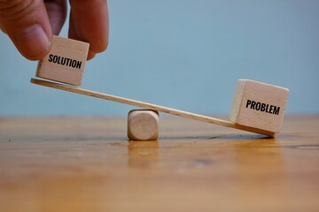 The Concept of Balancing Problems and Solutions Represented by Wooden Blocks on a Seesaw. Balancing...