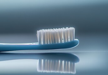 Close-up of a bamboo toothbrush with white bristles on a soft background