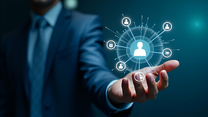 Businessman Demonstrating CRM for Customer Relationship Management: Futuristic Graphic Interface for Sales & Marketing with Database Analysis - Stock Photo Concept