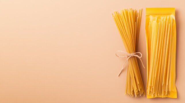 Bundle and package of uncooked spaghetti on neutral background.