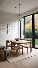 Fototapeta premium Modern minimalist dining room interior with wooden furniture, large glass windows, and natural light, creating a cozy and elegant Scandinavian-inspired home atmosphere