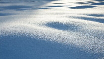 shadow and light on sunlit fresh white winter snow surface