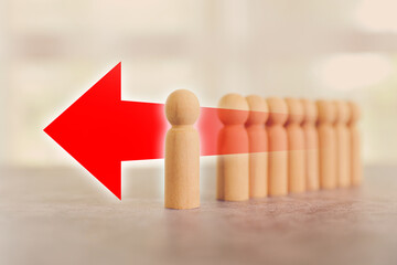 Wooden person stands with arrow way for HR human resources or personal leader training skill or leadership and challenge business team player and organization management teamwork.