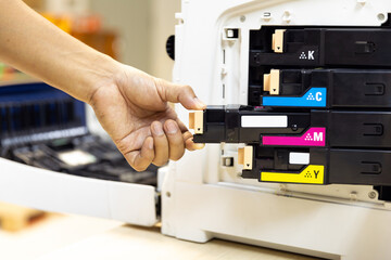 Technician Holding ink printer toner low for replace new or fix repair problem paper or print...
